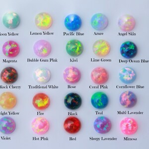 May include: A chart of 18 different opal cabochons, each with a unique color and pattern. The colors include: Moon Yellow, Lemon Yellow, Pacific Blue, Azure, Angel Skin, Magenta, Bubble Gum Pink, Kiwi, Lime Green, Deep Ocean Blue, Black Cherry, Traditional White, Rose, Coral Pink, Cornflower Blue, Bright Yellow, Fire, Black, Teal, Multi Lavender, Violet, Hot Pink, Red, Sleepy Lavender, and Mimosa.