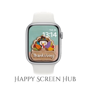 May include: A silver smartwatch with a white band displays a Thanksgiving-themed screen. The screen features a cartoon turkey wearing a hat, surrounded by colorful leaves, with the word "Thanksgiving" below. The time is 13:14 on Tuesday.