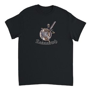 May include: Black t-shirt with a graphic of a skeleton warrior holding a shield and sword. The text "Raaaaawh" is displayed in a stylized font. The shield has an intricate design. A casual wear item.