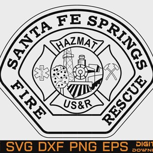 May include: A black and white circular emblem featuring the text SANTA FE SPRINGS FIRE RESCUE. The center displays a train, a derrick, a medical star, and crossed axes. The word HAZMAT appears at the top and US&R at the bottom of the central design.