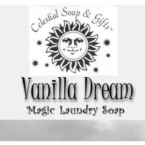 May include: A product label for "Celestial Soap & Gifts" with a smiling sun logo. The text reads "Vanilla Dream Magic Laundry Soap". The label is set against a soft, neutral background.