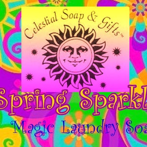 May include: A colourful, psychedelic design with a yellow sun and stars. The text reads "Celestial Soap & Gifts" and "Spring Sparkle Magic Laundry Soap".