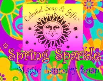 May include: A colorful, psychedelic design with a yellow sun and stars. The text reads "Celestial Soap & Gifts" and "Spring Sparkle Magic Laundry Soap".