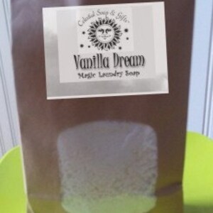 May include: A brown paper bag with a white label that says "Celestial Soap & Gifts" and "Vanilla Dream Magic Laundry Soap". The label has a sun with a face on it.
