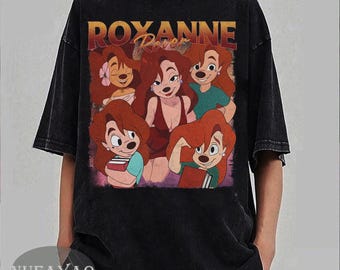 Può includere: T-shirt nero con grafica di Roxanne dal film "In viaggio con Pippo." Il design include il testo "Roxanne" in un font retrò, con più immagini del personaggio. La maglietta ha un aspetto vintage lavato.