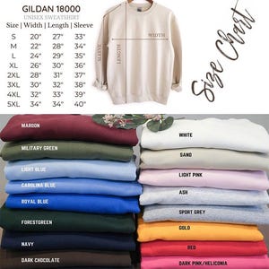 May include: A Gildan 18000 unisex sweatshirt in a neutral color is displayed, with a size chart showing measurements in inches. Below, a stack of sweatshirts in various colors like maroon, navy, and light pink are visible.