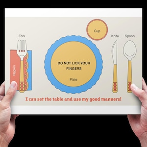May include: A diagram illustrating table setting etiquette, held by hands. It features a fork, napkin, plate, cup, knife, and spoon, with the text "Do Not Lick Your Fingers." The caption reads, "I can set the table and use my good manners!"
