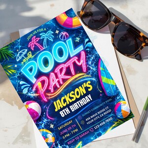 A neon blue and pink pool party invitation with glow-in-the-dark text, palm trees, and pool floats, lying on a white surface next to sunglasses and a pencil.