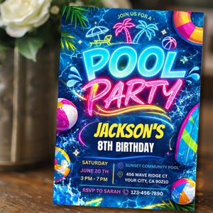 A neon blue and pink pool party invitation with glow-in-the-dark text, palm trees, and pool floats, standing upright next to a vase of white flowers.