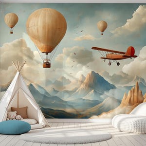 May include: A whimsical mural featuring hot air balloons, an airplane, and a teepee. The scene includes a large beige hot air balloon with a basket, a red biplane, and a white teepee with a blue ottoman. The background shows mountains and clouds.