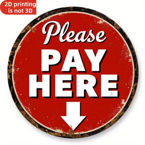 May include: A round, distressed metal sign with a red background and white text that reads "Please PAY HERE" with a downward-pointing arrow. The sign has a rusty brown border and the text "2D printing is not 3D" in a red box.