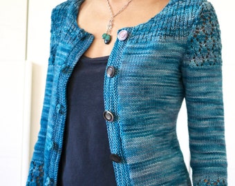May include: A blue and white striped cardigan with a lace pattern on the sleeves. The cardigan has a scoop neck and buttons down the front.