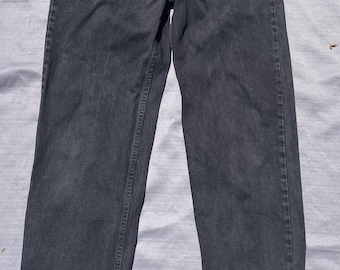 Jeans Levi's 555 vintage para hombre, talla 33x34, color negro, fabricados en EE. UU., corte relajado, pierna recta.