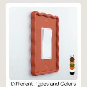 May include: A terracotta-coloured light switch cover with a wavy, rectangular frame. The white light switch is in the on position. The image includes the text "Different Types and Colors" at the bottom.