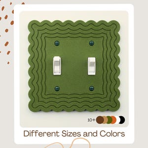 May include: A green double light switch cover with a scalloped edge design. The cover has two white toggle switches and four small screws. The text "Different Sizes and Colors" is at the bottom of the image.