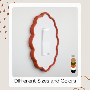May include: A decorative light switch cover with a scalloped, terracotta-coloured frame. The white switch plate has a white toggle switch. The image includes the text "Different Sizes and Colors" and a colour palette of available colours.