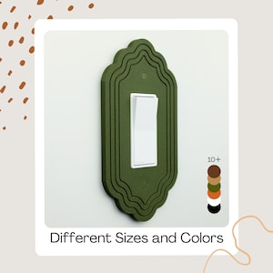 May include: A decorative olive green light switch cover with a white switch. The cover has a detailed, ornate design. The image includes the text "Different Sizes and Colors" and a color palette.