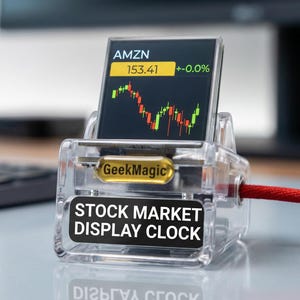 以下が含まれることがあります： AMZNの株式データを示す小さな画面を備えた、透明なアクリル製の株式市場表示時計。画面には株価チャートと現在の価格が表示されます。時計には赤いコードと「STOCK MARKET DISPLAY CLOCK」の文字があります。