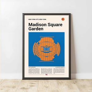 May include: Framed poster with a graphic of Madison Square Garden in New York City. The design uses orange and blue colours. Text includes "Madison Square Garden" and other details about the venue.