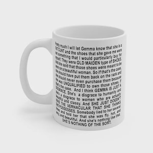 May include: White ceramic mug with a black, handwritten-style text. The text is a rant about someone named Gemma and her choice of shoes. The mug has a standard handle and a plain white background.