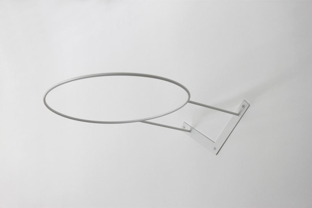 Exercise ball clearance stand