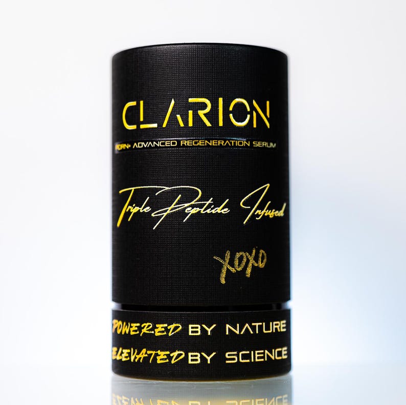 May include: A black cylindrical product container with gold lettering. The text on the container reads "CLARION", "Triple Peptide Infused", and "POWERED BY NATURE ELEVATED BY SCIENCE". The container has a textured surface and a white background.