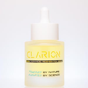 May include: A frosted glass bottle of Clarion Advanced Regeneration Serum. The bottle has a white dropper and cap. The yellow serum is visible inside. The text "CLARION" is in yellow, and "POWERED BY NATURE ELEVATED BY SCIENCE" is in blue.