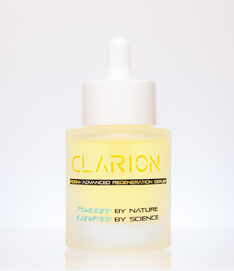 May include: A frosted glass bottle of Clarion Advanced Regeneration Serum. The bottle has a white dropper and cap. The yellow serum is visible inside. The text "CLARION" is in yellow, and "POWERED BY NATURE ELEVATED BY SCIENCE" is in blue.