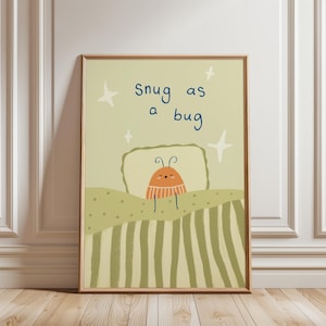 Peut inclure: Une affiche encadrée avec une illustration d'un insecte de dessin animé dans un lit, avec le texte "snug as a bug". L'œuvre utilise des couleurs pastel douces. L'impression est dans un cadre en bois, idéale pour une chambre d'enfant.