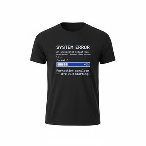 May include: Black t-shirt with white text that reads "SYSTEM ERROR" above a simulated computer screen. The screen shows a progress bar at 40% and the text "Formatting complete - life v2.0 starting.."