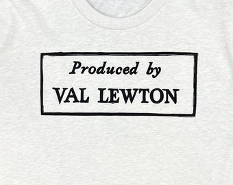 May include: A white t-shirt with black text that reads "Produced by VAL LEWTON".