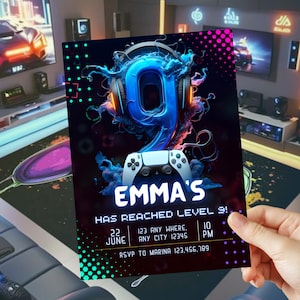 May include: A gaming-themed birthday invitation. The card displays a large blue number 9 with headphones, a game controller, and the text "EMMA'S HAS REACHED LEVEL 9!" with event details. The background shows a gaming room setting.
