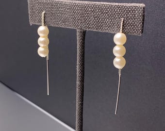 Pendientes de hilo con perlas