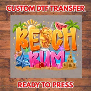 May include: A colorful graphic with the words "BEACH RUM" in large, stylized letters. The design includes a cocktail, a slice of watermelon, a beach chair, and a sandcastle. The text "CUSTOM DTF TRANSFER" and "READY TO PRESS" are also included.