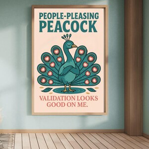 May include: A framed art print featuring a teal peacock illustration with a teal and pink tail. The text at the top reads "PEOPLE-PLEASING PEACOCK" and the text at the bottom reads "VALIDATION LOOKS GOOD ON ME."