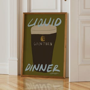 a chartreuse bar cart print that has a drawing of a guiness pint on it and pastel blue typography that says "Liquid Dinner" by Stephie Cardona for KunstbyStephie