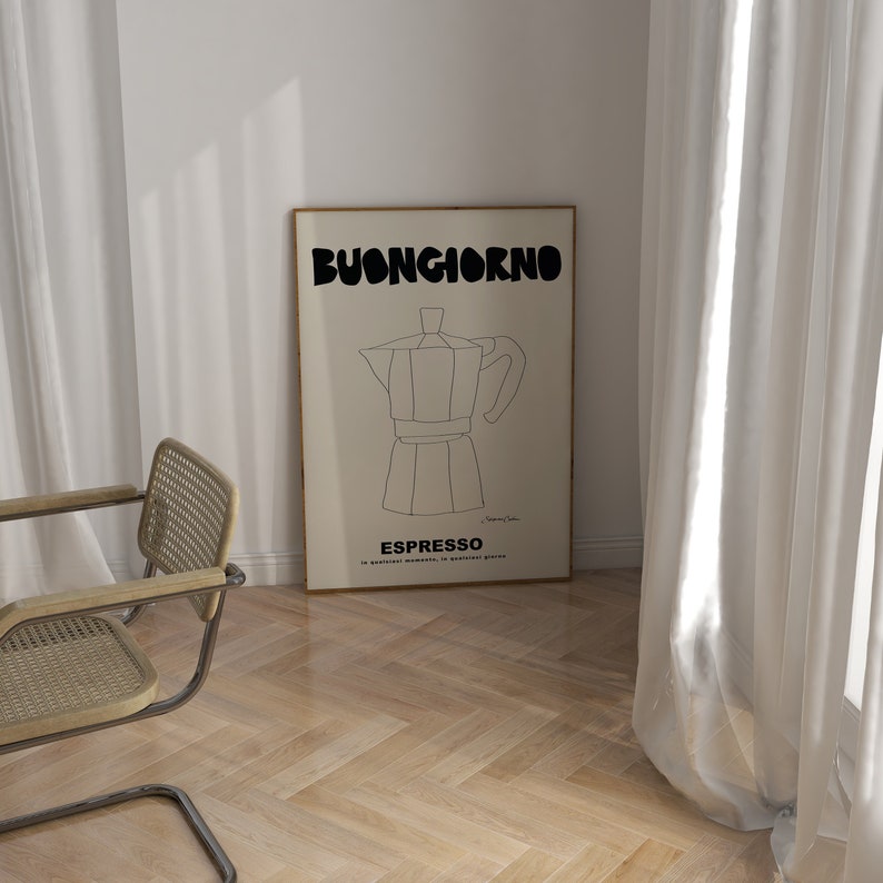 May include: A rectangular framed wall art print featuring a cream background with a black line drawing of a moka pot. The text BUONGIORNO is printed in large black letters at the top, with ESPRESSO and smaller Italian text printed below the drawing.