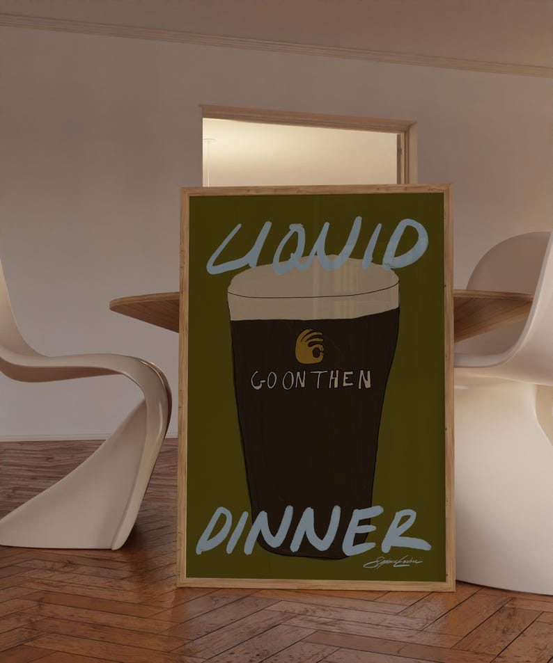 May include: A white ceramic mug with a black handle and the text "But First, Coffee" in a bold, black font. The mug is set against a blurred background, suggesting a cozy setting. The mug appears to be approximately 4 inches tall.