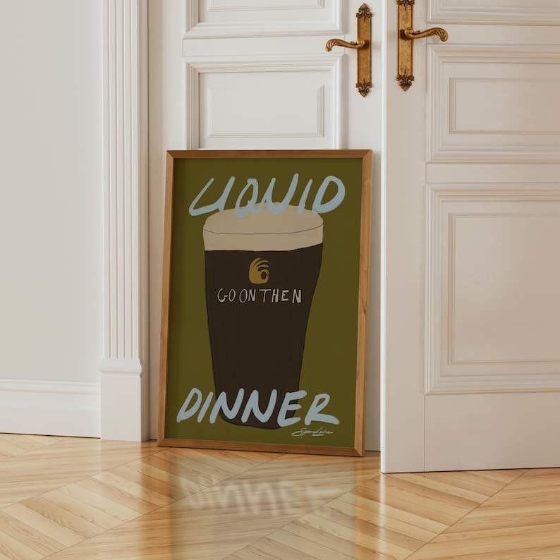 a chartreuse bar cart print that has a drawing of a guiness pint on it and pastel blue typography that says "Liquid Dinner" by Stephie Cardona for KunstbyStephie