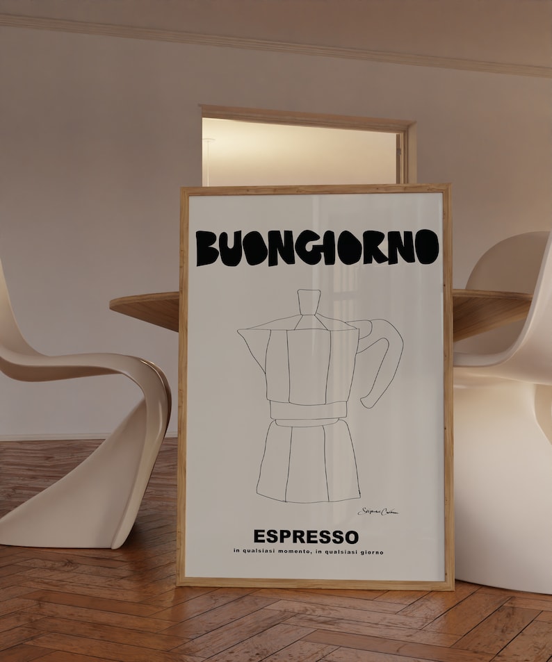 May include: A rectangular framed wall art print featuring a black line drawing of a moka pot centered on a white background. The text BUONGIORNO appears in large bold black letters at the top, with ESPRESSO and smaller text below the drawing.