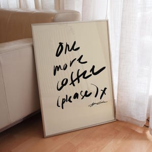 beige coffee station poster that says in black script typography "one more coffee please" illustration by Stephie Cardona the perfect kitchen wall art or poster for chic cafe or modern coffee bar
