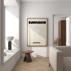 May include: A rectangular wall art print in a wooden frame featuring a black line drawing of a moka pot centered on a cream background. The text BUONGIORNO appears in large black letters at the top, with ESPRESSO and smaller text below.