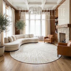 May include: A luxurious living room featuring a curved cream-colored sofa, two brown leather armchairs, and a large round rug with a sunburst pattern. The room has hardwood floors, a stone fireplace, and a crystal chandelier. The text "Pileandpalette" is visible.