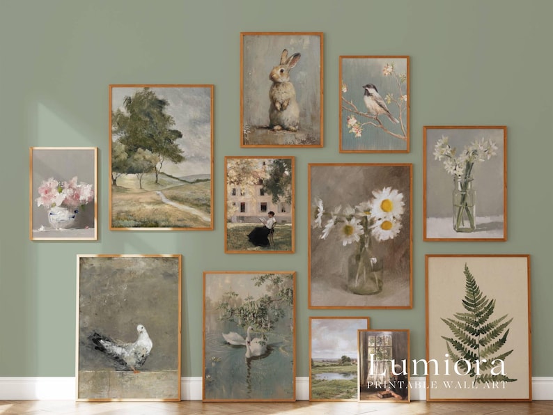May include: A collection of framed vintage-style art prints. The prints feature various subjects, including a rabbit, birds, flowers, landscapes, and a fern. The frames are a warm brown color, and the overall aesthetic is rustic and charming.