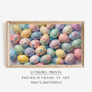 May include: A framed print featuring a collection of painted Easter eggs in various pastel colors. The eggs are decorated with floral and abstract patterns. The frame is a light wood color. The text "LUMIORA PRINTS" and "PREMIUM FRAME TV ART" are visible.