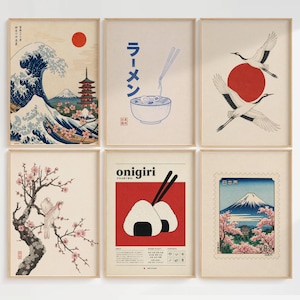 Peut inclure: Un ensemble de six affiches encadr&eacute;es pr&eacute;sentant des illustrations d'inspiration japonaise. La collection comprend une vague avec le mont Fuji, un bol de ramen avec du texte japonais, deux grues, un oiseau sur une branche de cerisier, des onigiri et un timbre.