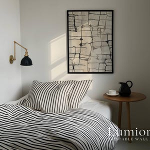May include: A framed rectangular wall art piece featuring a black and white abstract grid pattern hanging above a bed with black and white striped bedding. The text Lumiora Printable Wall Art is visible in the bottom right corner of the image.