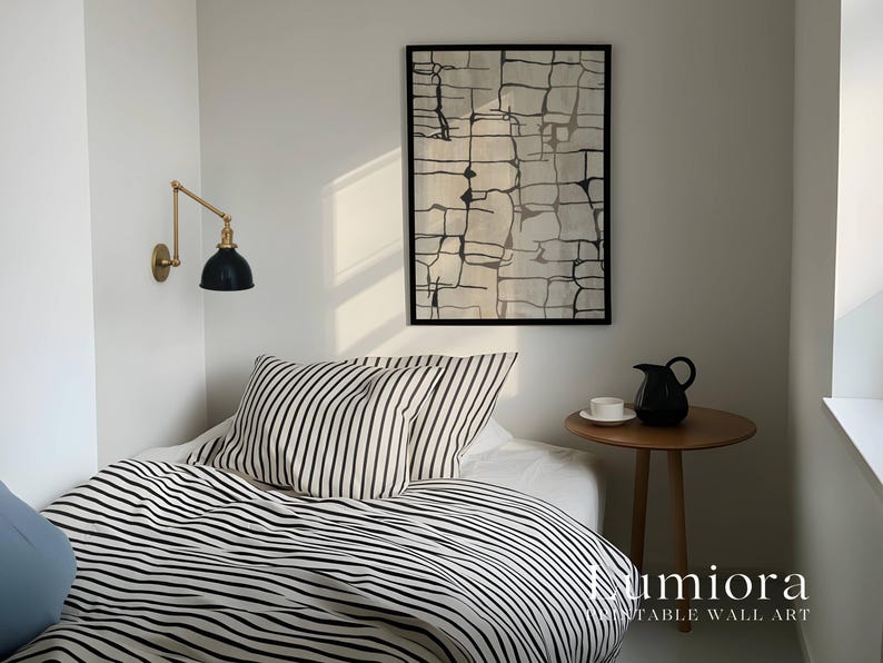 May include: A framed rectangular wall art piece featuring a black and white abstract grid pattern hanging above a bed with black and white striped bedding. The text Lumiora Printable Wall Art is visible in the bottom right corner of the image.