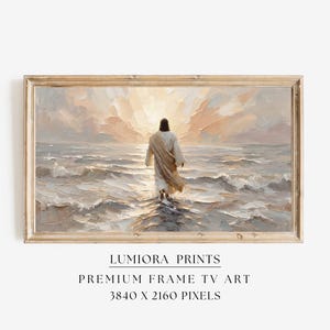 May include: A framed painting depicts a figure walking on water towards a bright light. The artwork features a warm color palette with shades of beige, cream, and light blue. The frame is a light brown color. The text "LUMIRA PRINTS" and "PREMIUM FRAME TV ART" is visible.