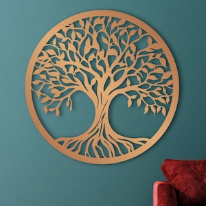 May include: Bronze-colored metal wall art depicting a tree within a circle. The tree's branches and roots are intricately cut out, creating a detailed design. The word "Bronze" is in the lower left corner.